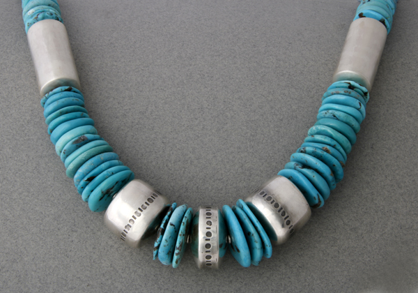 Large necklace with handmade silver beads and round shards of Turquoise.
